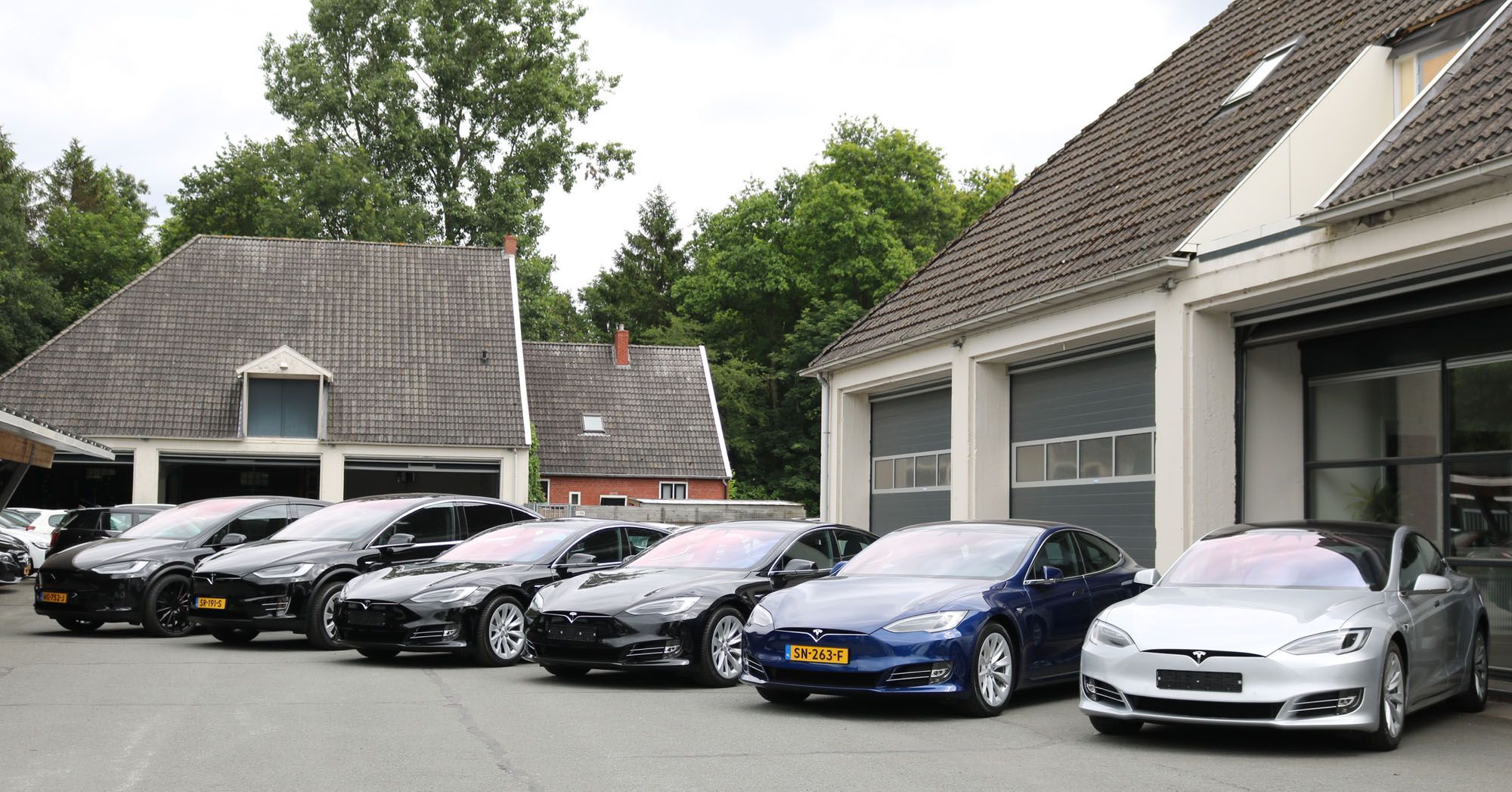 Tesla cars vehicles lined up